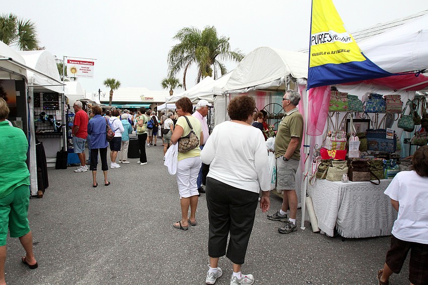 The crowd makes it way through all the booths at the 17th annual Siesta Key Craft Festival Saturday, Feb. 5, in Siesta Key Village.