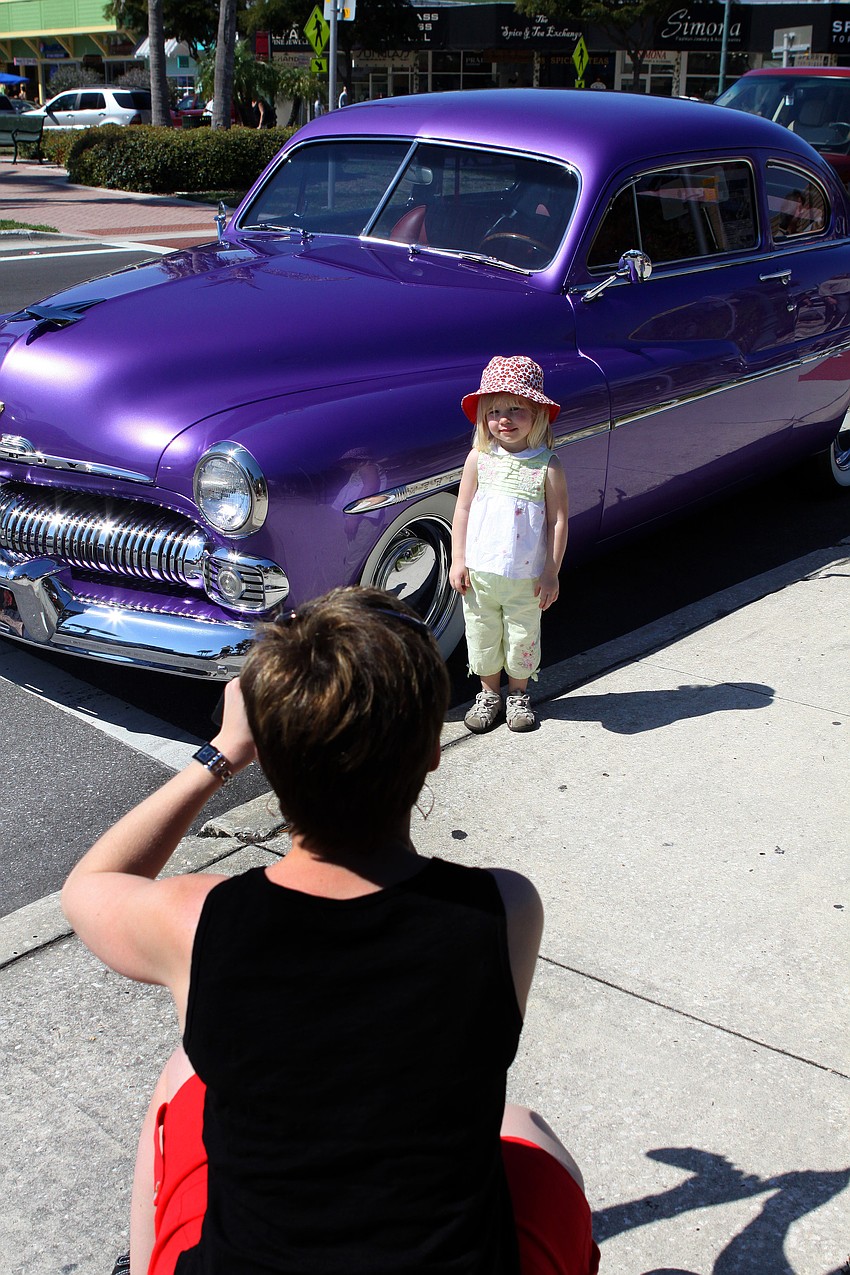 Jodi Easton takes a photo of Kathryn Easton in front of the 