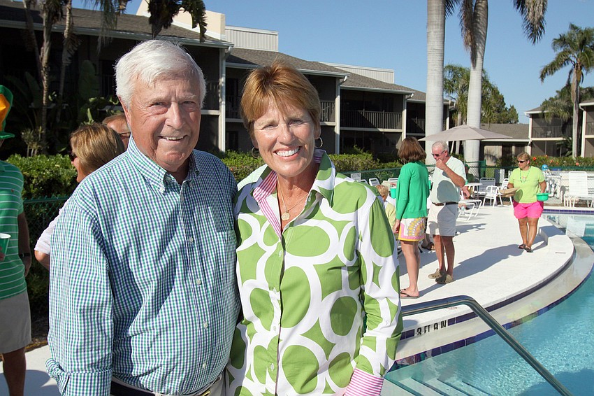 Pete Reidy and Bett Aden pose together by the pool at Cedars West on Thursday, March 17 during Cedars West's St. Patrick's Day party.