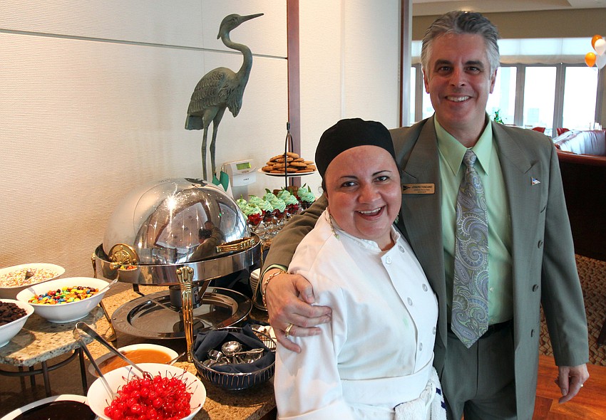 Linda Rivera, pastry chef, and Joseph Toscano pose near the dessert area on Thursday, March 17 at Sarasota Yacht Club.