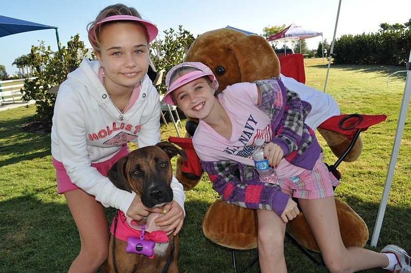 Erin Moos and Kori Southcott, both 10, are pictured with Roxie.
