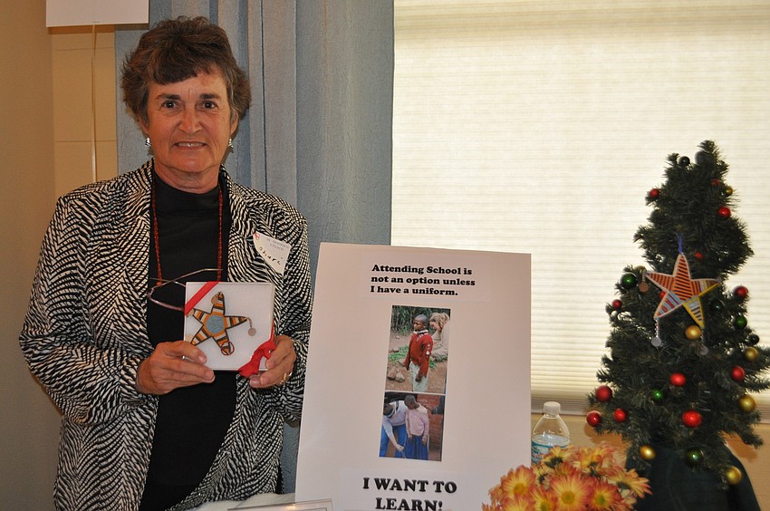 Sheri Sadler manned a booth selling star ornaments to buy uniforms for school children in Tanzani.