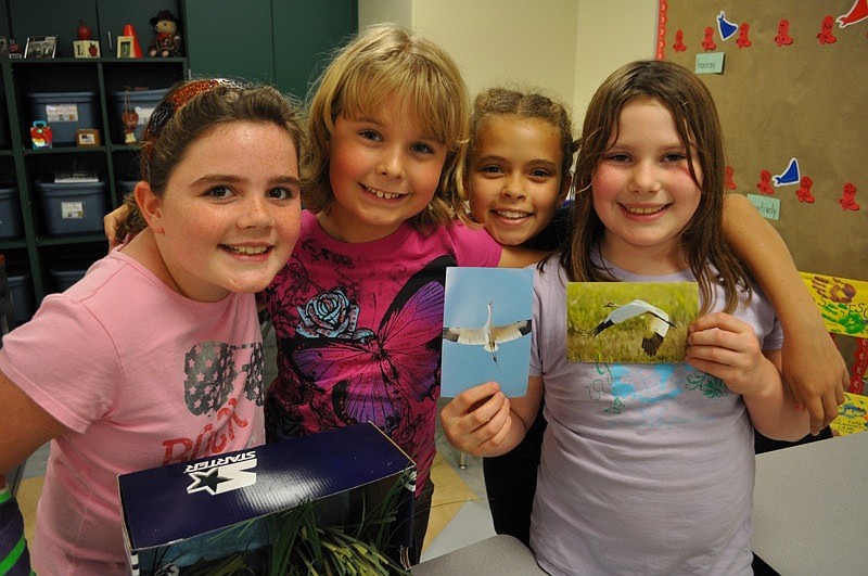 Olivia Leckie, Sasha Krill, Heaven Bazo and Malory Wilson were eager to share information about the animals they researched.