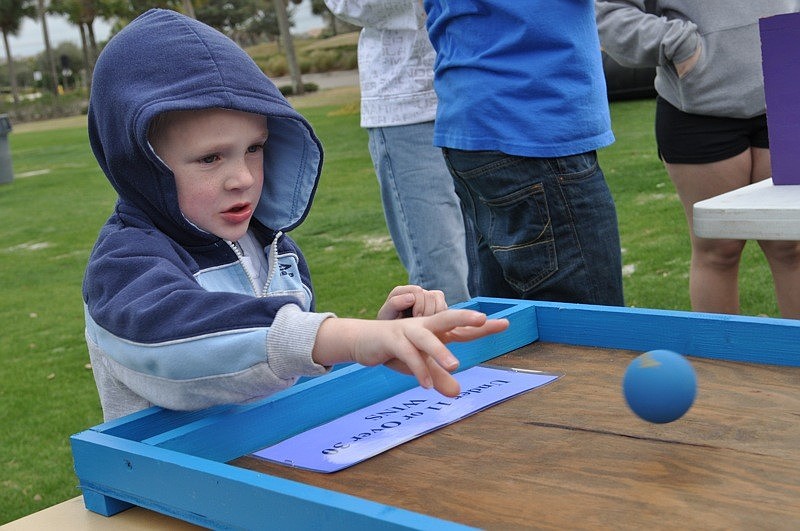 Joe Smillie, 5, was determined to succeed at a ball rolling game.