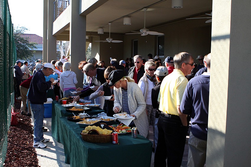 People mingle on Friday, Jan. 28 during Longboat Key Public Tennis Center's Chili Cook-off competition.
