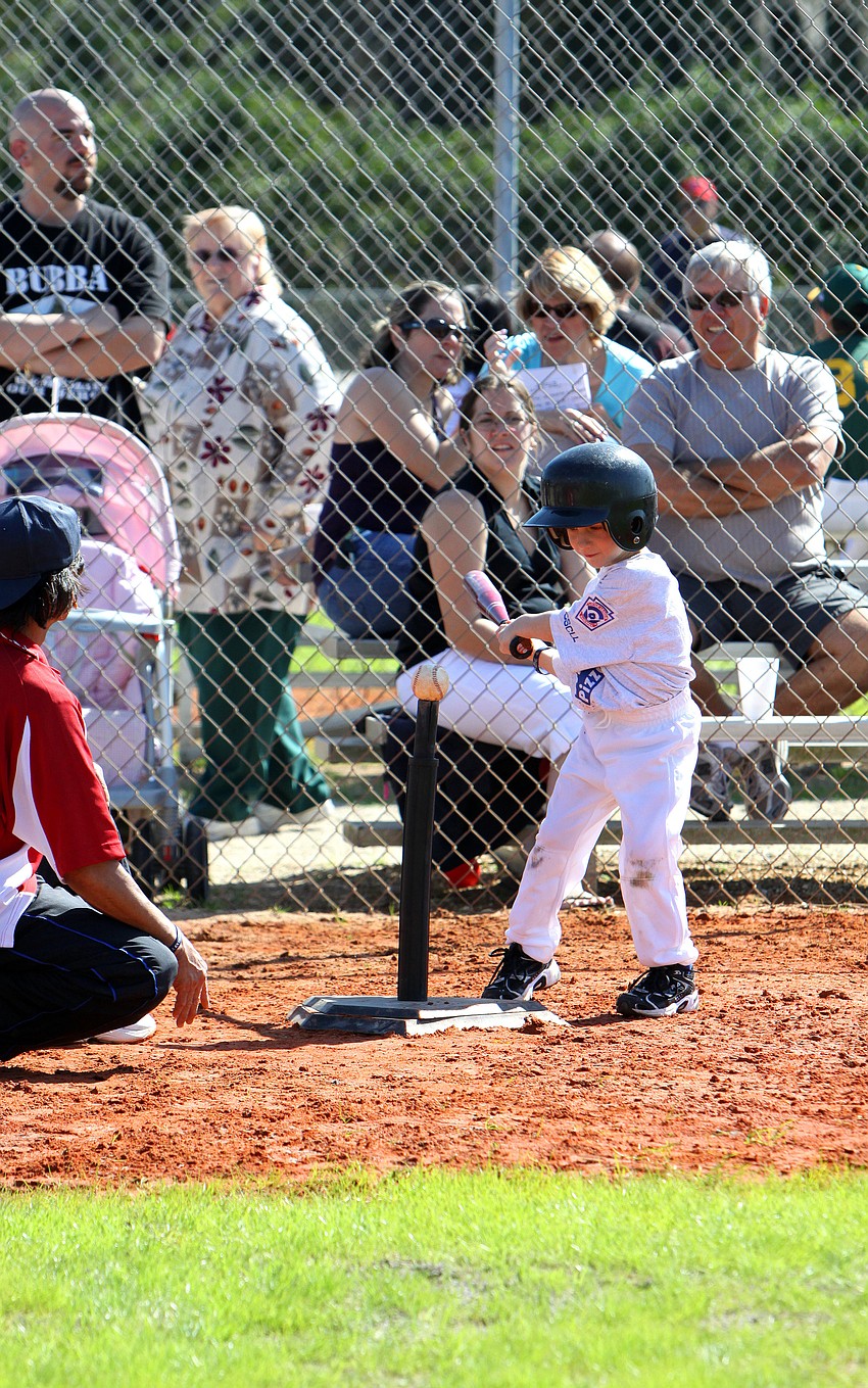 Luke Michael Kehrer, 5, gets ready to swing at the ball on the tee on Saturday, Feb. 19 at Twin Lakes Park during Central Sarasota Little League Opening Day.