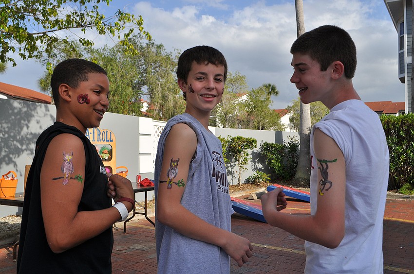 The View baskbetball players Demarco Bryant, Dominic Caldwell and Joe Sinopoli show off their face and body paint.