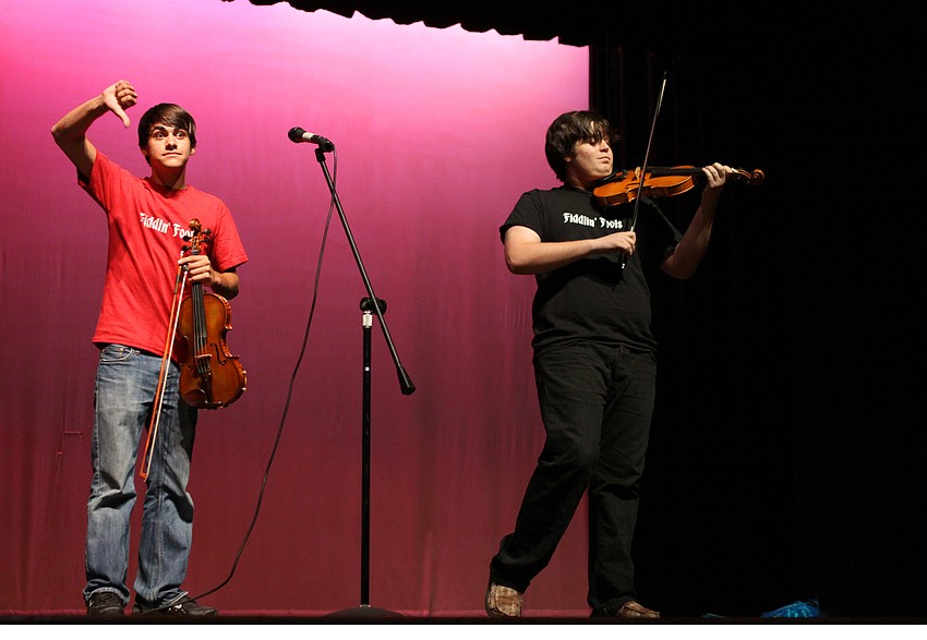 Alex Hunsader tries to get the audience to boo fellow fiddler, Nick Gamardella.