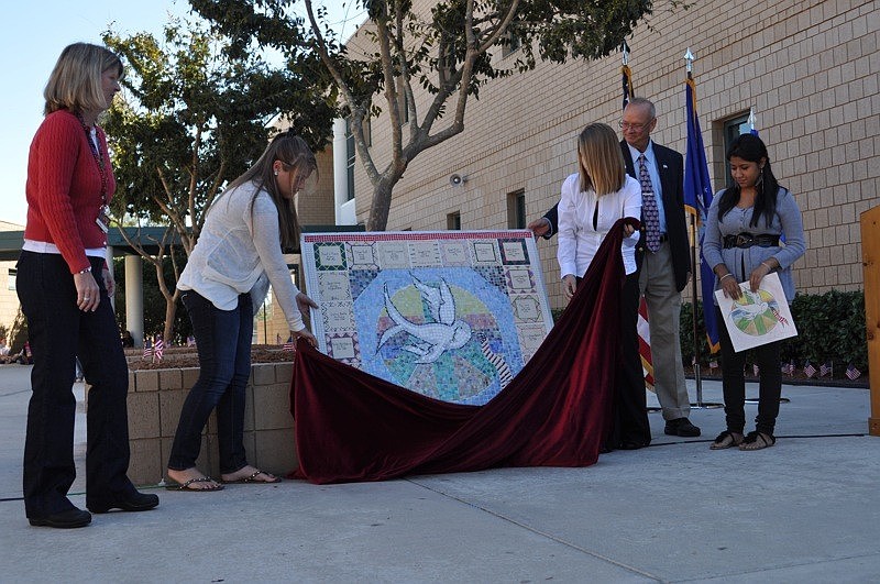 As part of the ceremony, students unveiled the newest panel of the Veterans Walk of Honor.