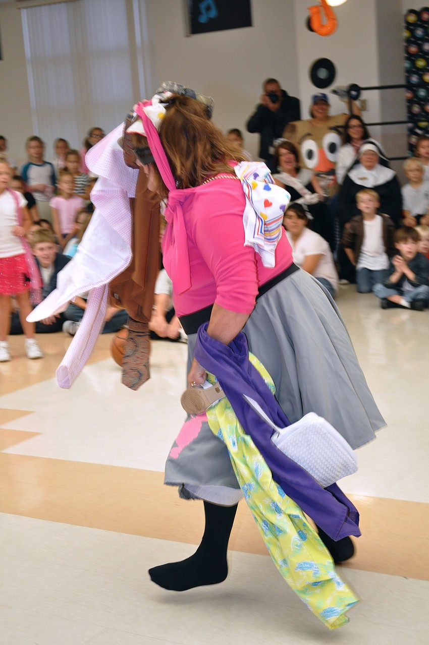 Teacher Patti Lidtke races around the room.