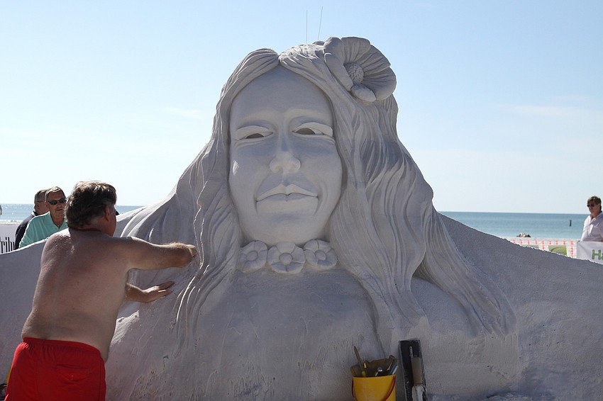 Bill Dow works on his sculpture 