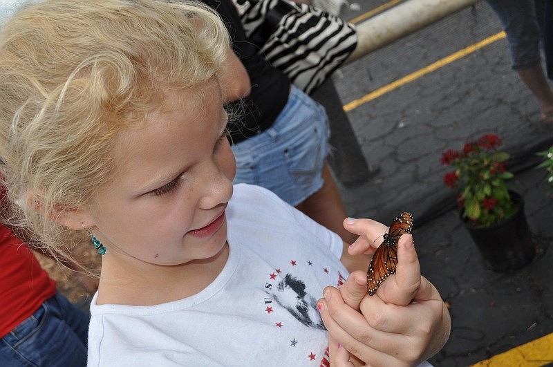 Adryona Richolson, 7, held several butterflies.