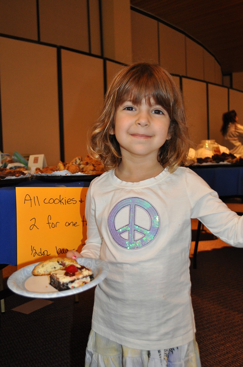 Mia Rosenthal makes a plate full of desserts.
