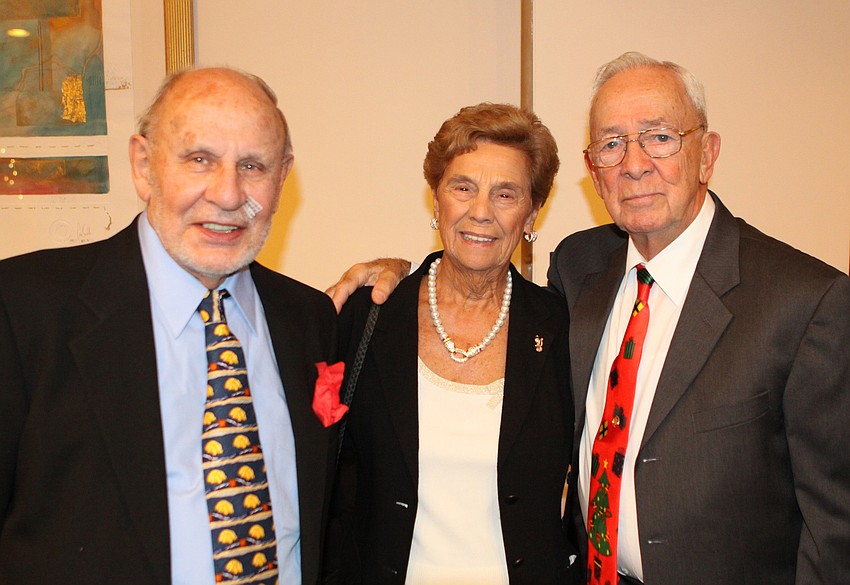 John Lafrance poses with Dottie and Augie Pirolli inside Seaplaceâ€™s clubhouse.
