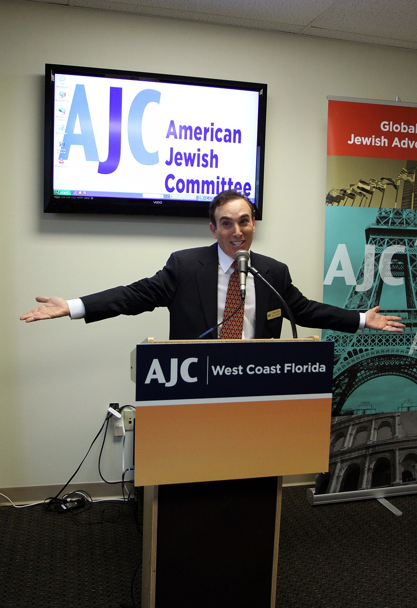 Brian Lipton welcomes everyone to the new Sarasota office inside the Bank of America Building during AJCâ€™s Grand Opening Cocktail Party Thursday evening.