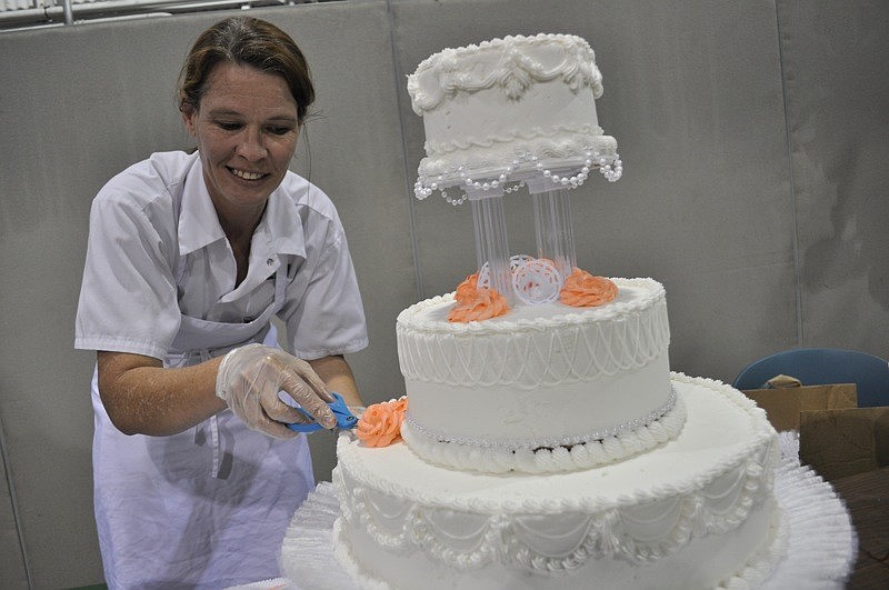 Missy Hartley of Publix demonstrated how to decorate wedding cakes.