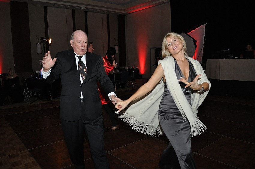 Harry Call and Ilona Tiscenko share a dance after dinner.