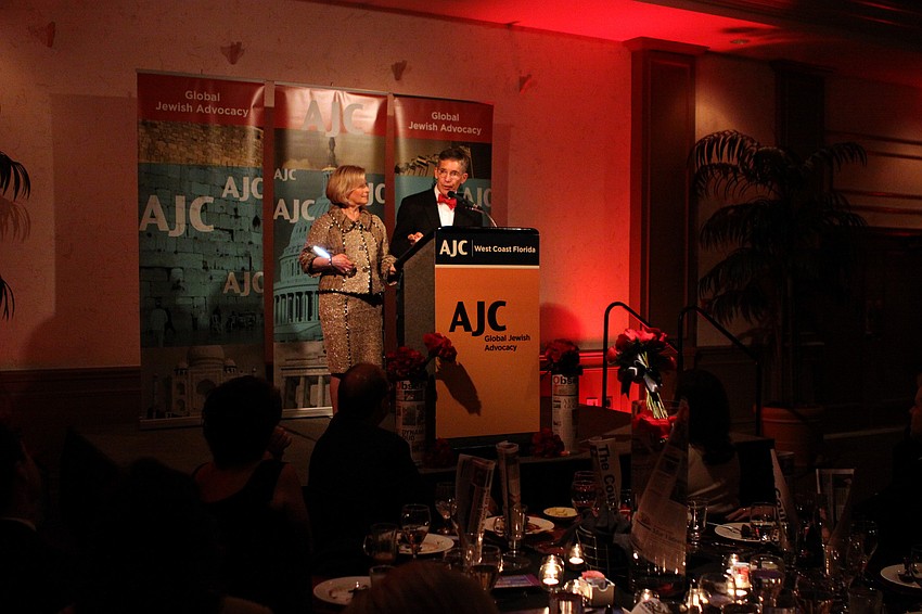 Lisa and Matt Walsh accept their award