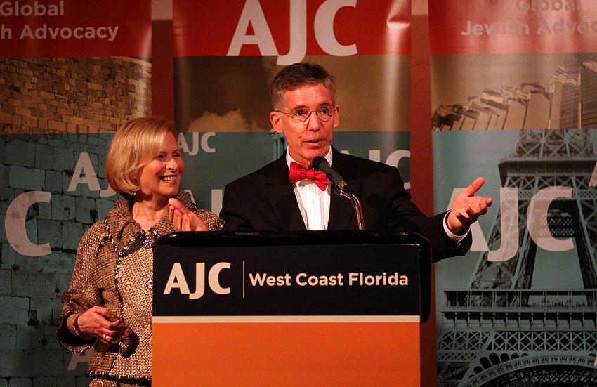 Lisa and Matt Walsh accept their award