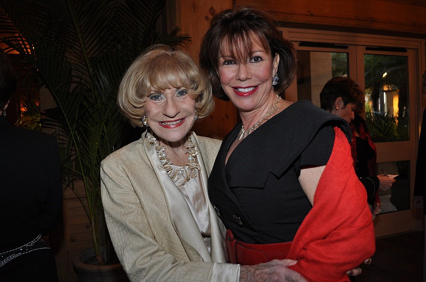 Flori Roberts and Donna Simmons modeling jewelry from the auction