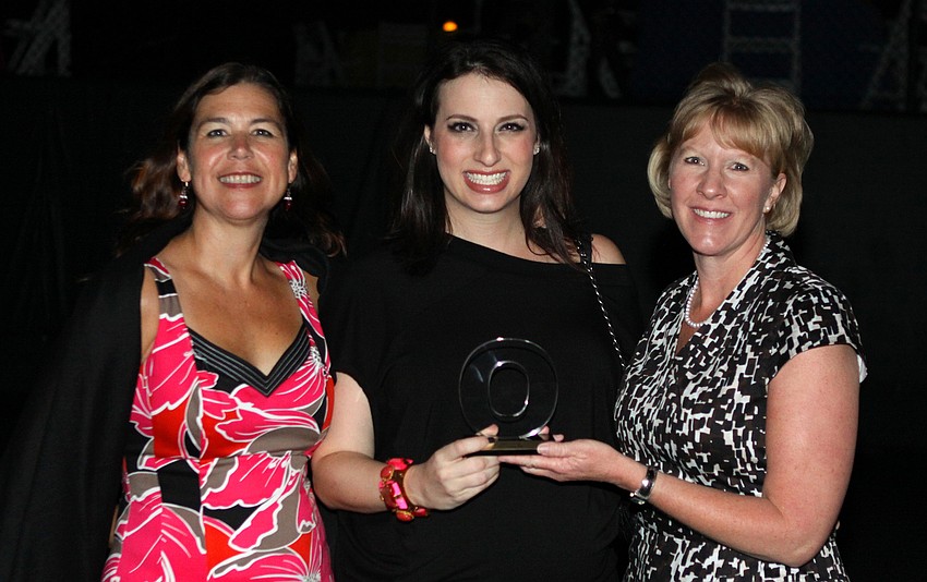Paula Murray, Kyla Weiner and Angie Stringer accept the award for Standout Invitation for Moonlight Regatta