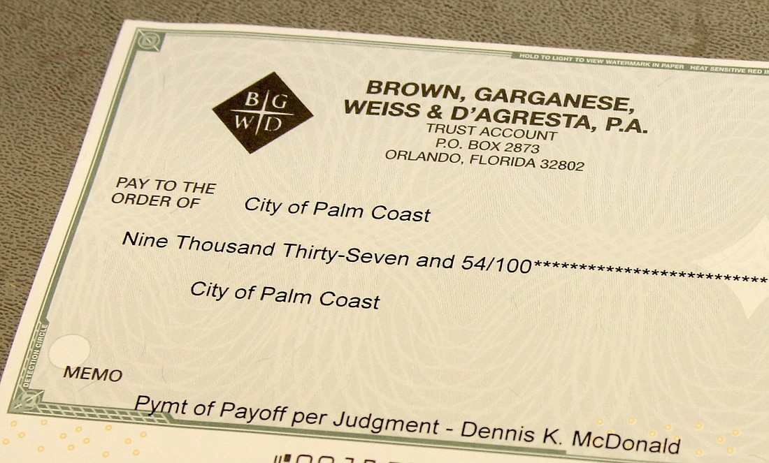 Dennis McDonald paid the city $9,037.54.