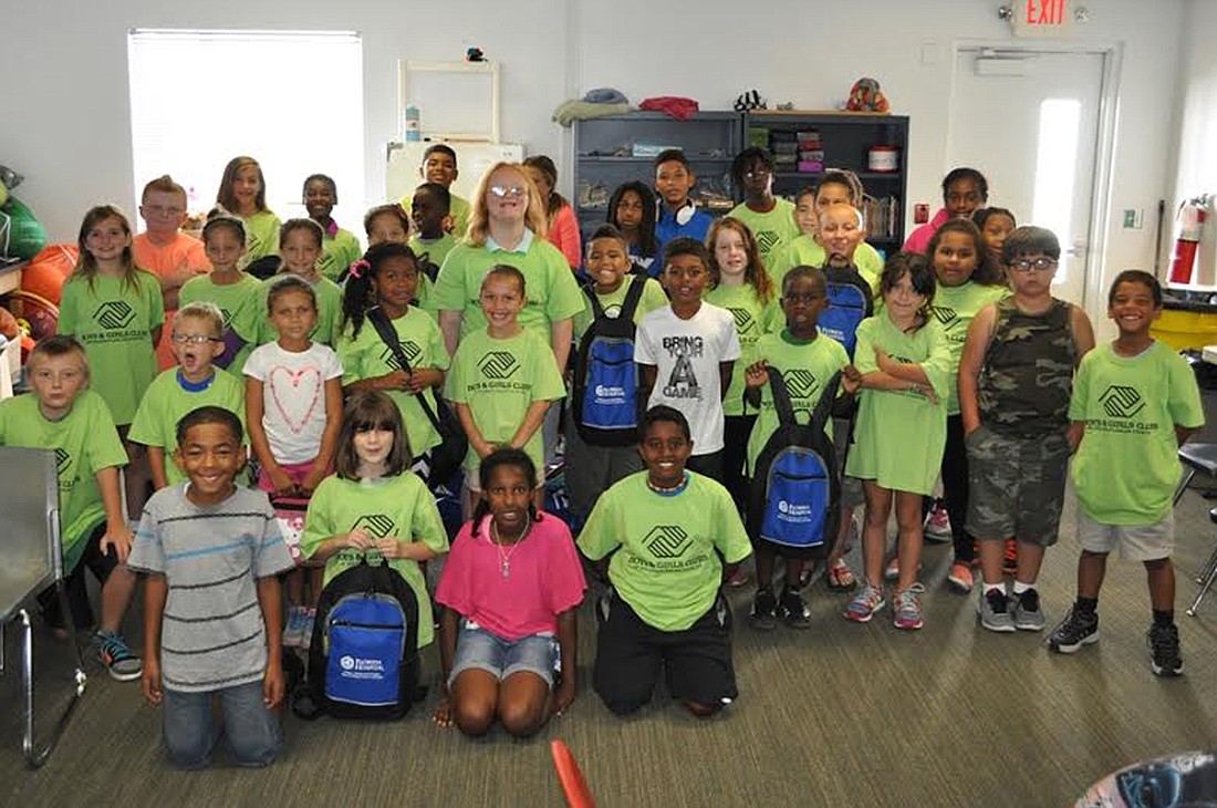 Boys and Girls club students receive backpacks full of supplies. Courtesy photo
