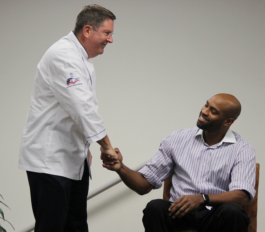 Chef Kevin Gallagher presented Vince Carter with homemade pickles and jelly that was made at the facility. Photos by Jeff Dawsey