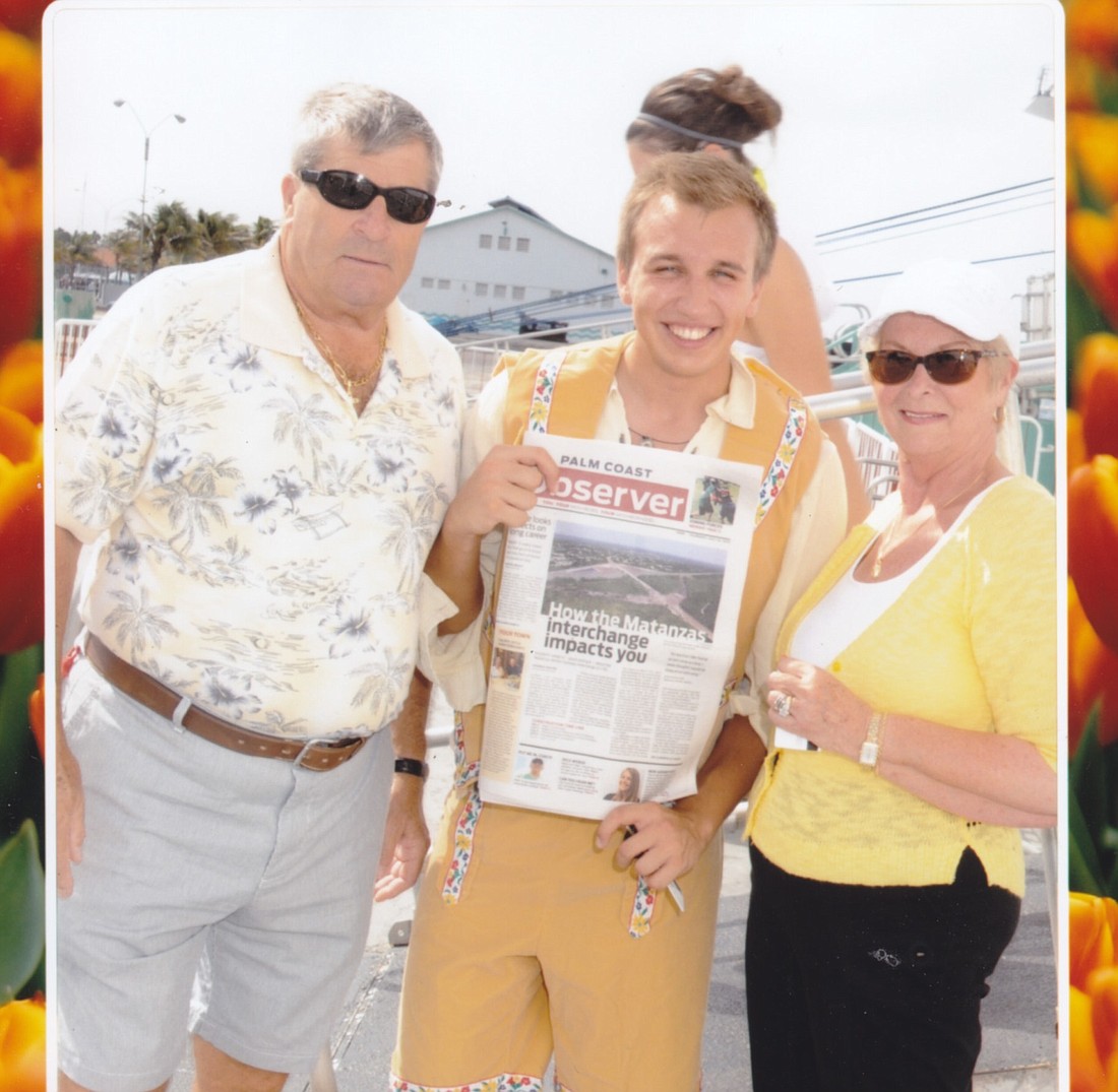 Pete Weber and Adrienne Parish with their paper and a "friend' in Aruba. Courtesy Photo