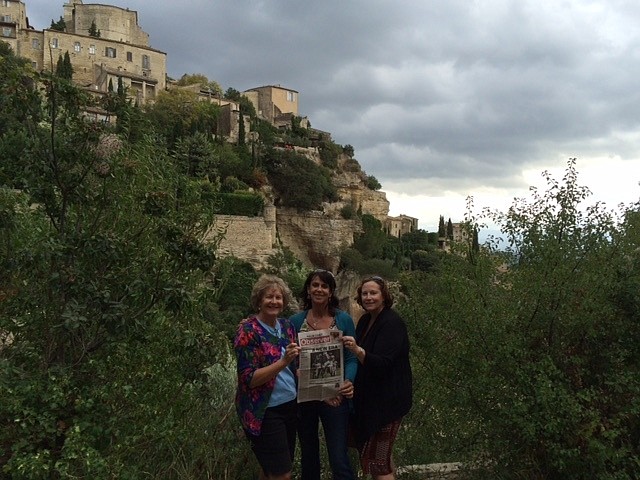 Elena Cunningham, Marie Durigan, and Lynn Paarmann in France with their Palm Coast Observer. Courtesy Photo
