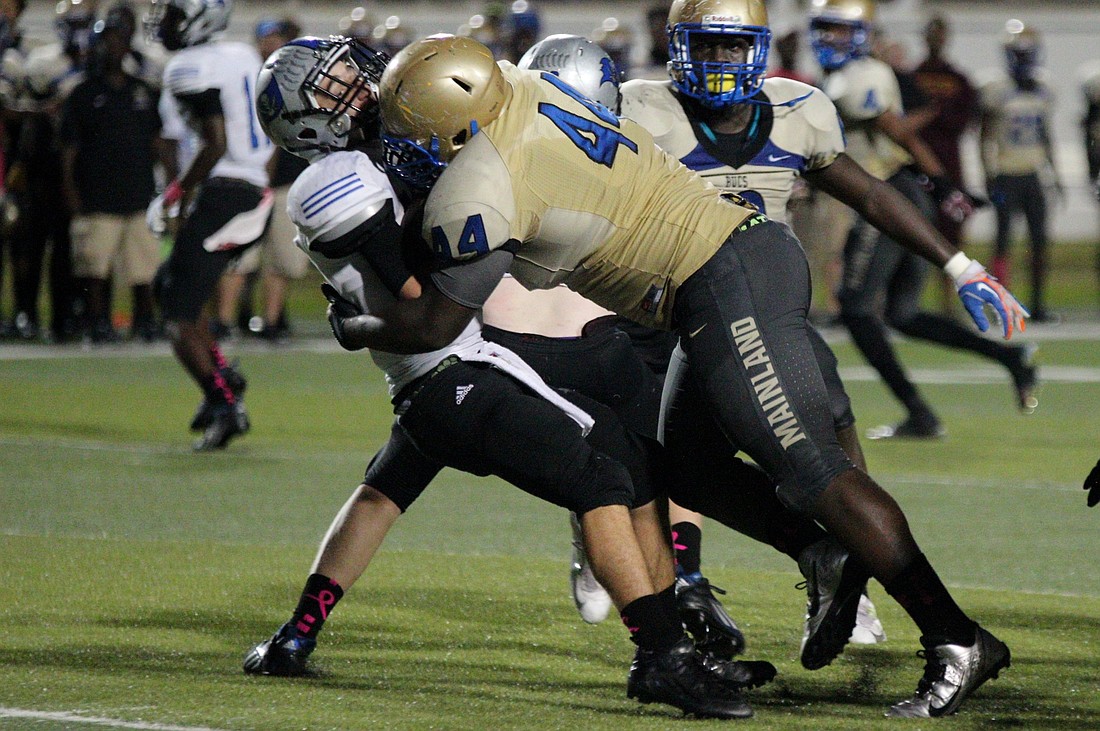 Mainland's Kevin McCrary sacks Mackenzy Wagner to force the Pirates to punt. Photo by Jeff Dawsey