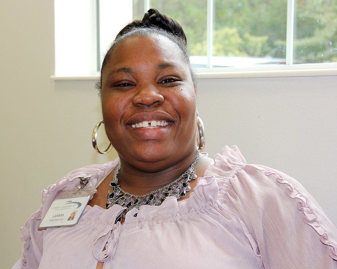 Letisha Tennant, intake specialist at Project WARM, has a lot to smile about. Photo Jacque Estes