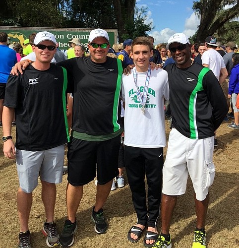 Justin Pacifico, along with coaches Alex Giorgianni, David Halliday and Coach Virgil Williams. Photo by Vinny Pacifico
