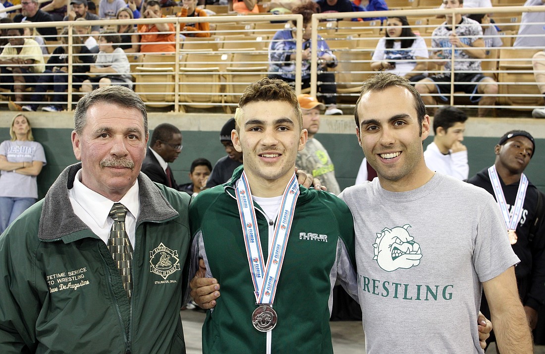 Steve DeAugustino, Michael, who placed fourth at last year's state tournament, and Stephen Jr. Photo by Jeff Dawsey