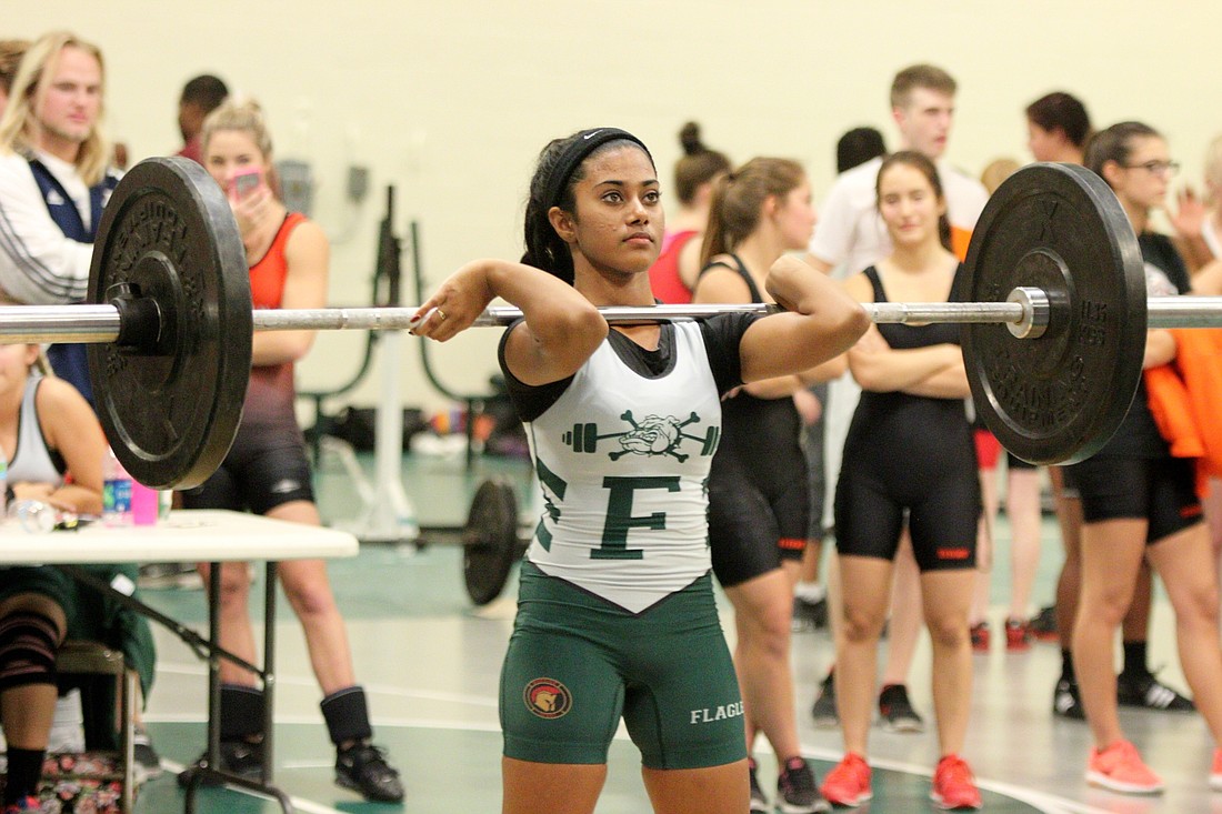 Tiara Sanker broke the school bench record with 110 pounds.