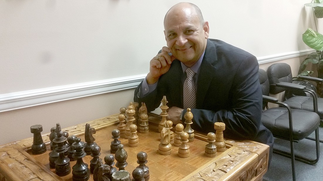 Oscar Alvarado keeps a hand-carved, one-a-kind chess set from the Philippines in his lobby. It helps keep him sharp.