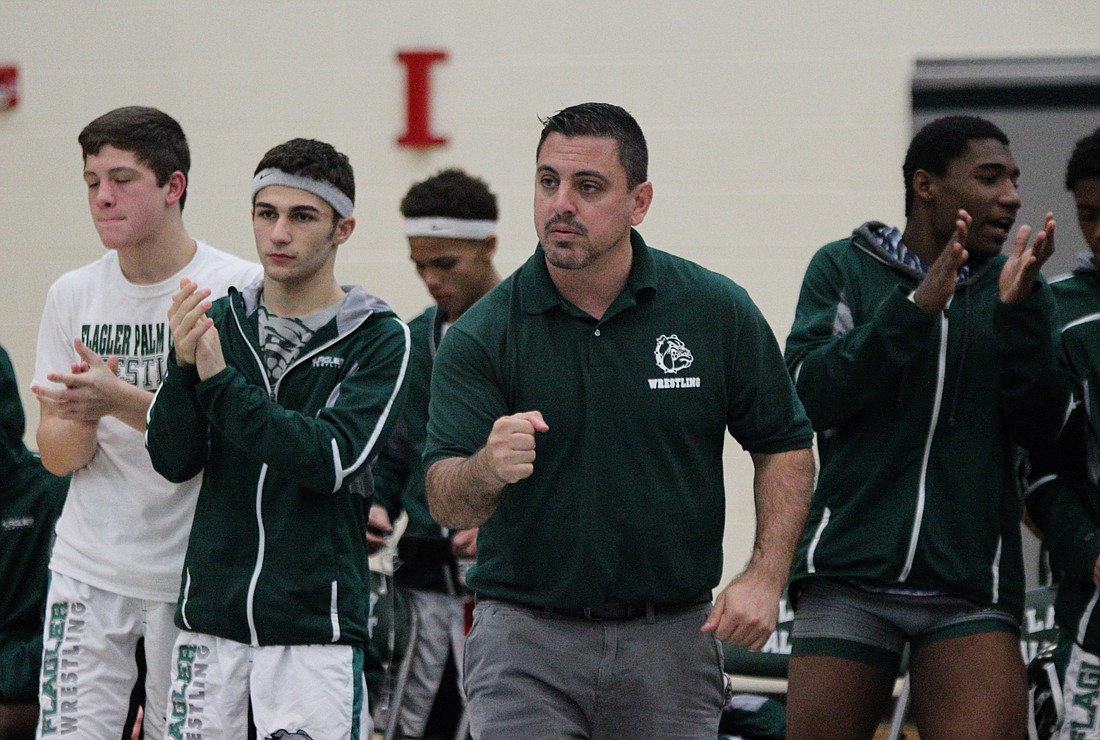 Head coach Tom Bartolotta and company celebrate Tariq Johnson's pinfall overTristan Kraus.