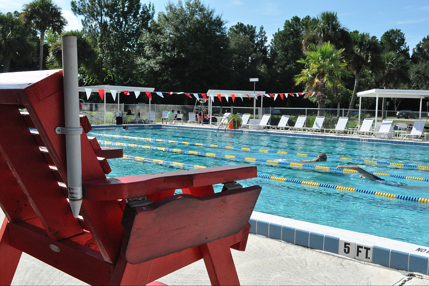 Members swim laps at the Belle Terre Swim and Racquet Club. (File photo)