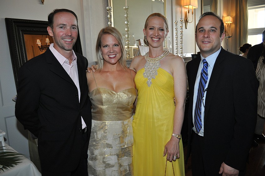 Fran and Jamie Becker, Chairwoman Ariane Dart and Mitch Davis