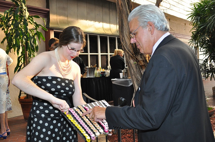 Flannery Moran shows buttons to Gregg Glasser