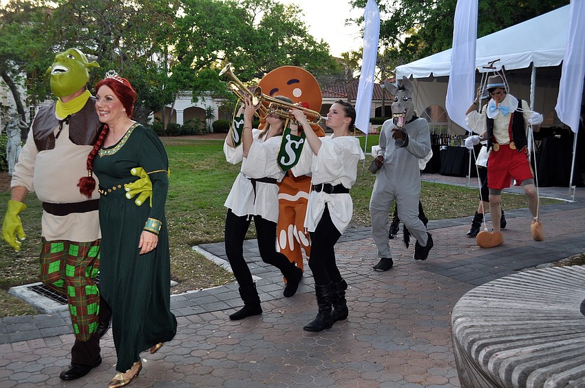 Dr. Larry and Pat Thompson lead the “Shrek” parade.