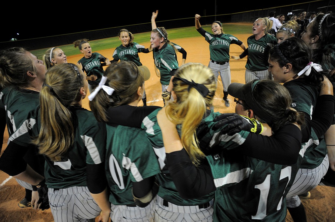 The Lakewood Ranch High softball team celebrates following its 2-1 victory over rival Braden River in the Class 4A-District 10 championship April 22.
