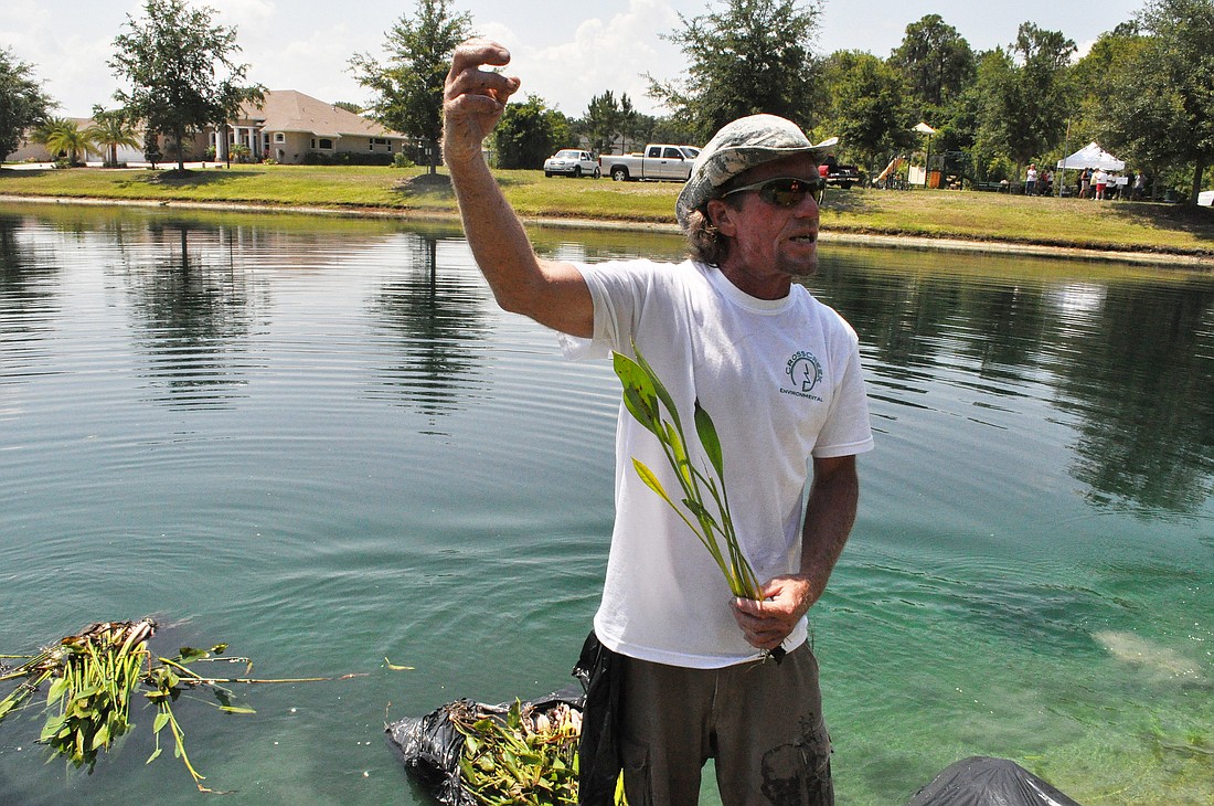 CrossCreek Environmental's Danny Dunn showed residents how to plant.