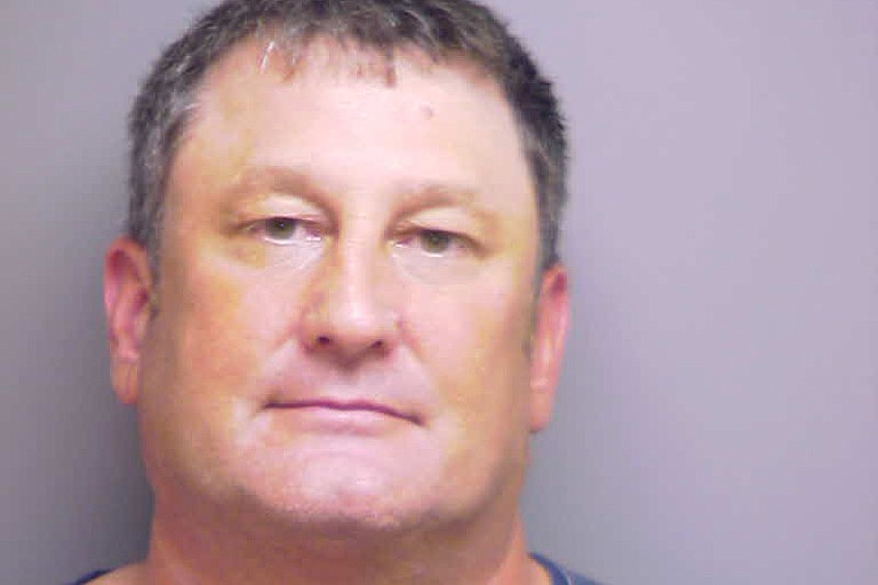 John Sabin, 45, was charged with aggravated battery for beating John Lee in the parking lot at Braden River Elementary School.