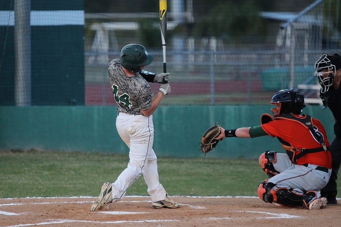 FPC catcher Danny Rodriquez takes a mid-eighties fastball off the rear during a game against Mandarin on Thursday in Palm Coast. (Photo by Joey LoMonaco)