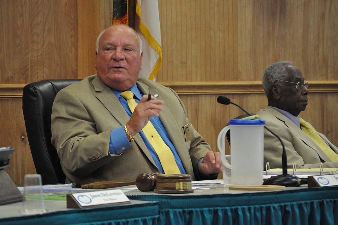 Palm Coast Mayor Jon Netts and Councilman Bill Lewis discussed rezoning a State Road 100 lot for commercial use during a June 3 City Council meeting. Photo by Jonathan Simmons.