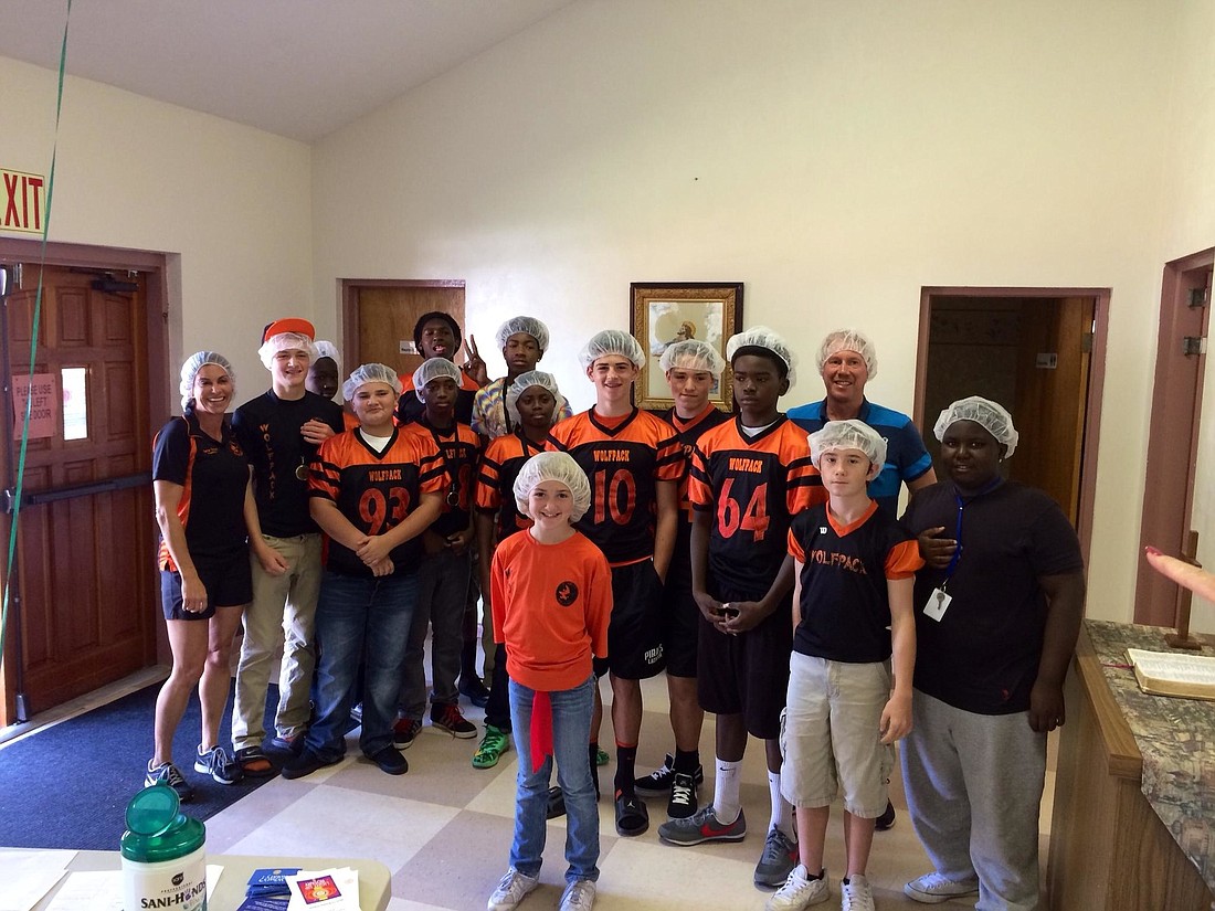 The Flagler Wolfpack 14U volunteered to help package 10,000 meals for the Stop Hunger Now the day after winning their conference championship.