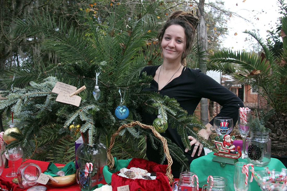 Amy Glenn mans her table at the craft fair portion of the event. Her business Kind Knots specializes in custom ornaments.