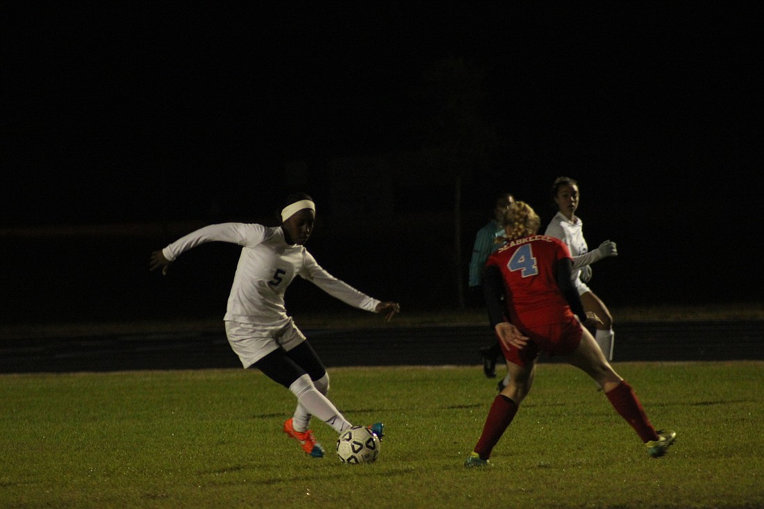 Miracle Porter crosses a defender with her speed to find an open player.