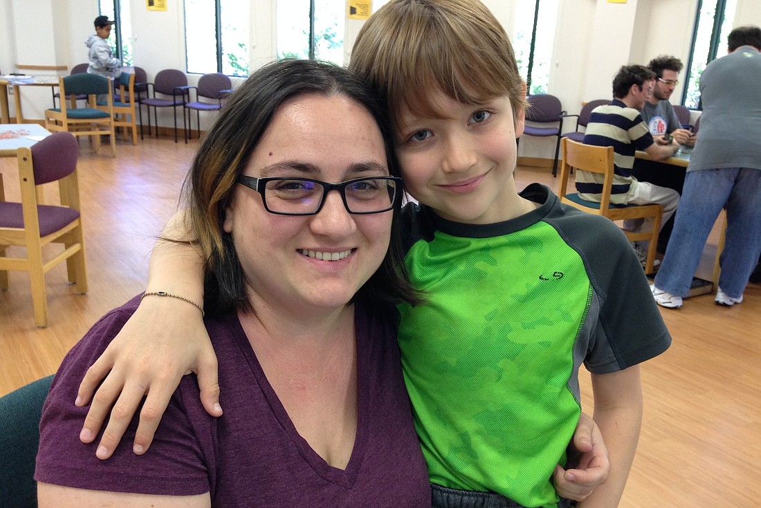 Anna Nevod organizes Game Day monthly at the library, and her son, Matthew, reviews board games on a YouTube channel.